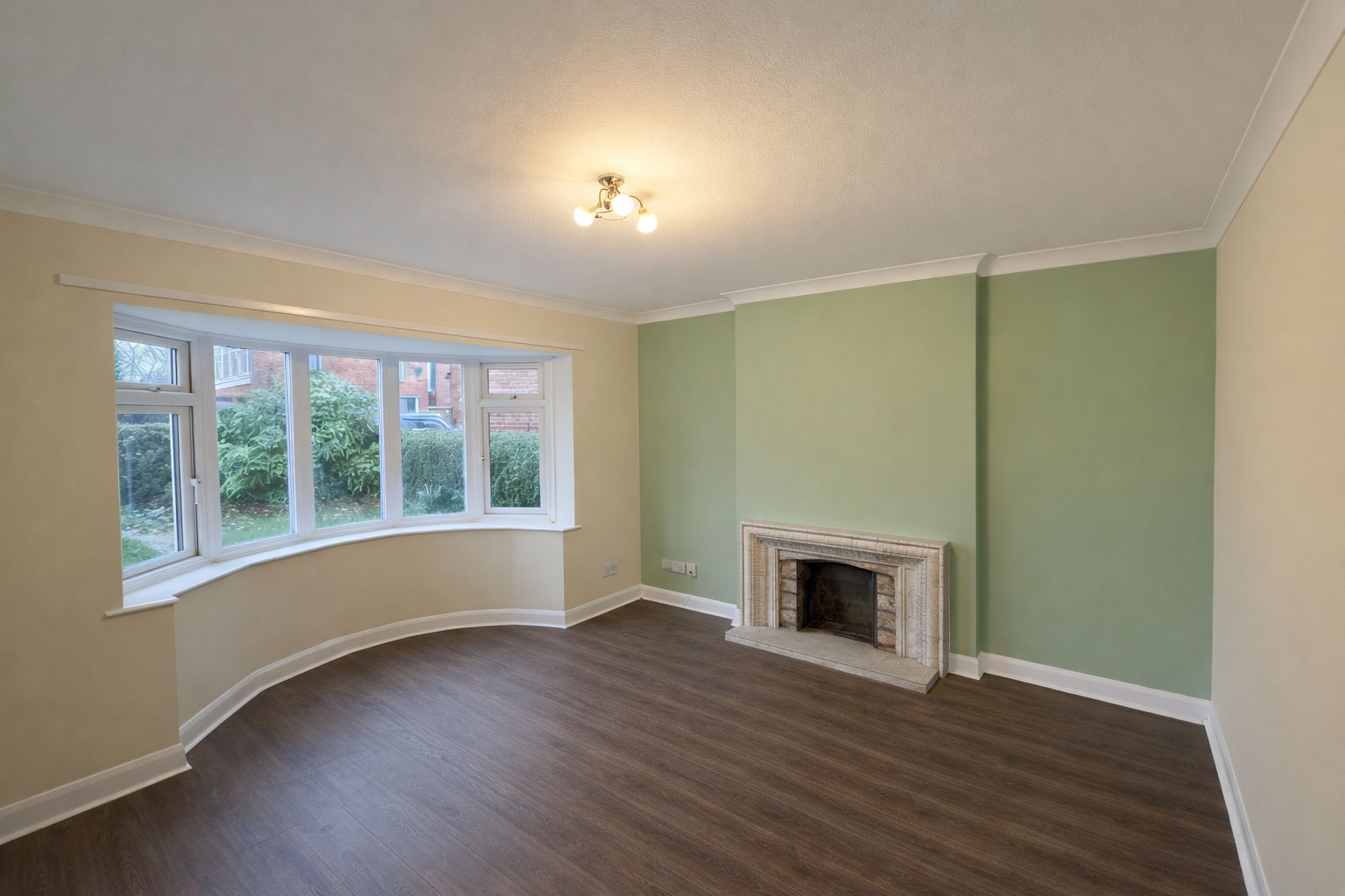 Freshly painted green room by JST Property Services