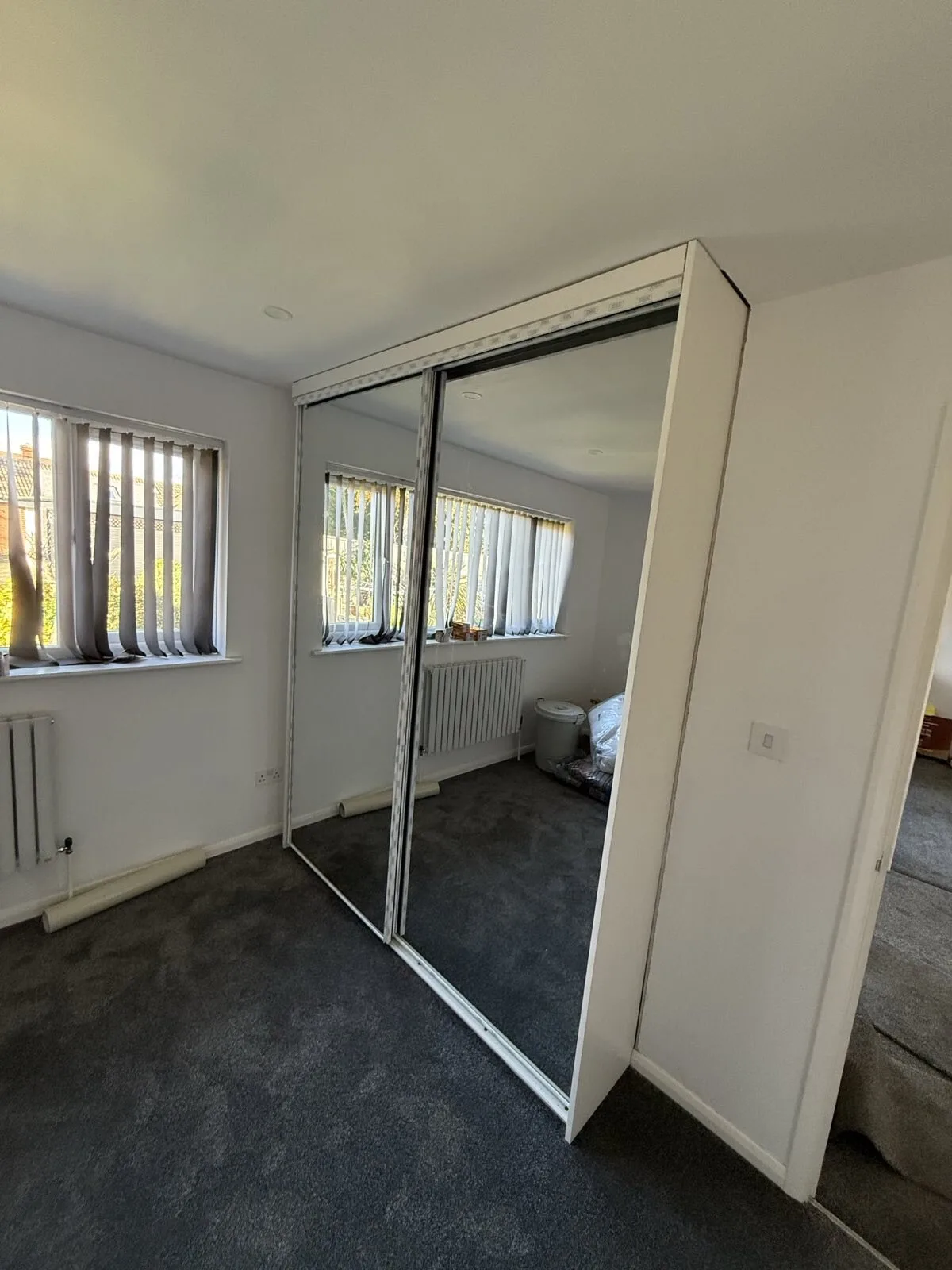 Fitted mirrored wardrobes by JST Property Services